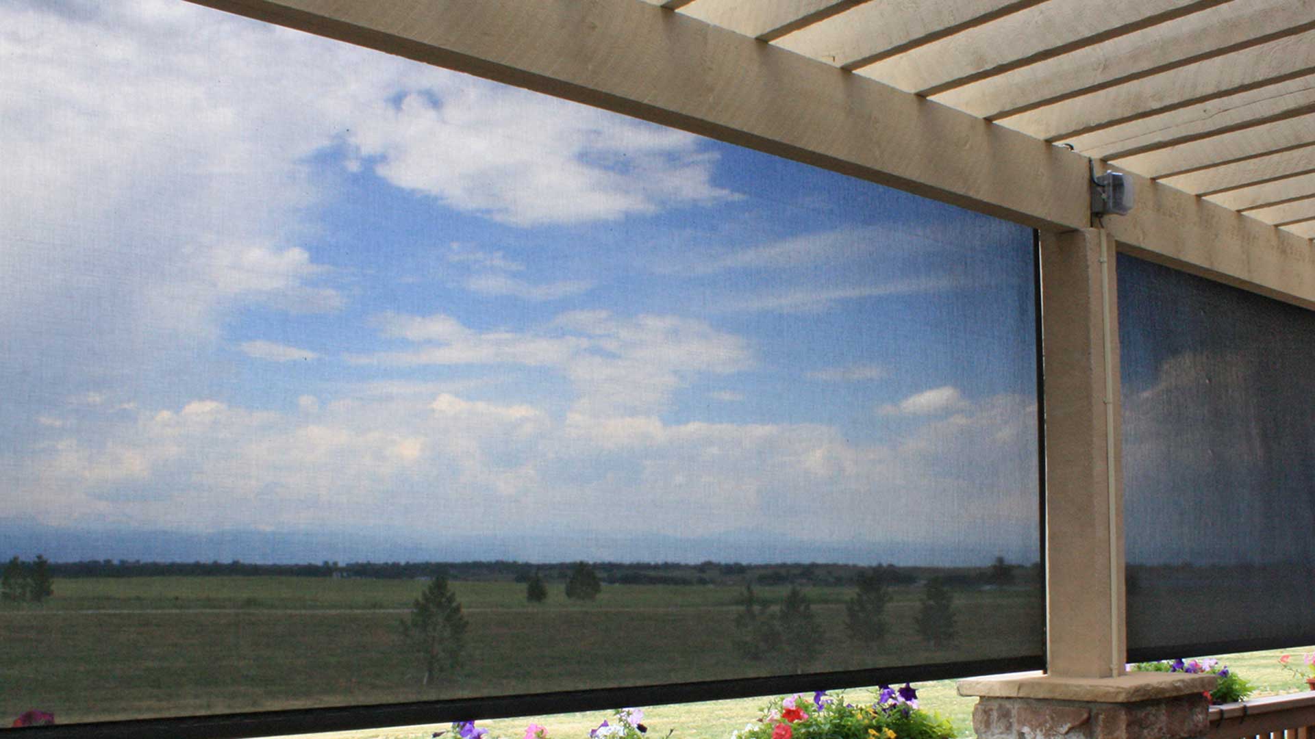 Motorized exterior patio shade solar powered