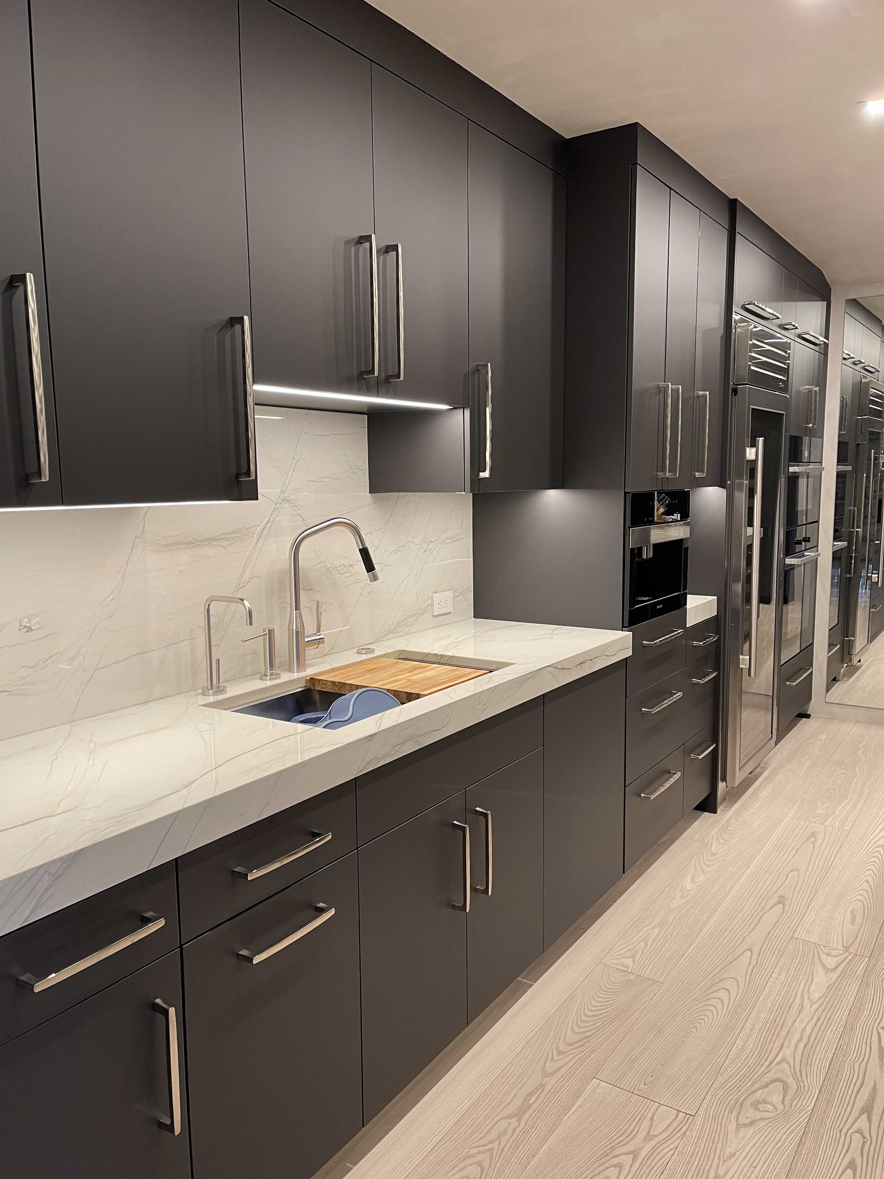 Matte Graphite Contemporary Kitchen — graphite cabinetry with white quartzite countertops and backsplash