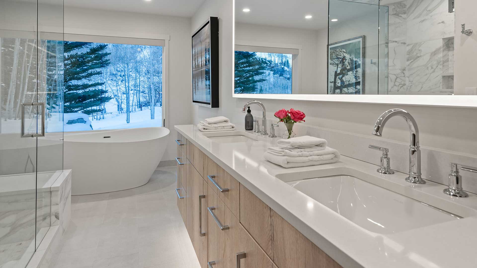 Master Bath — Light Wood Vanity with freestanding soaking tub and marble tile surround