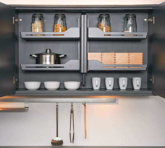 Wall pull-down storage system in raised position