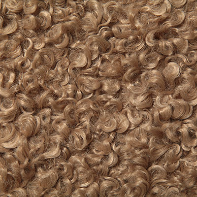 Camel shearling textile — plush warmth for lounge chairs and throws