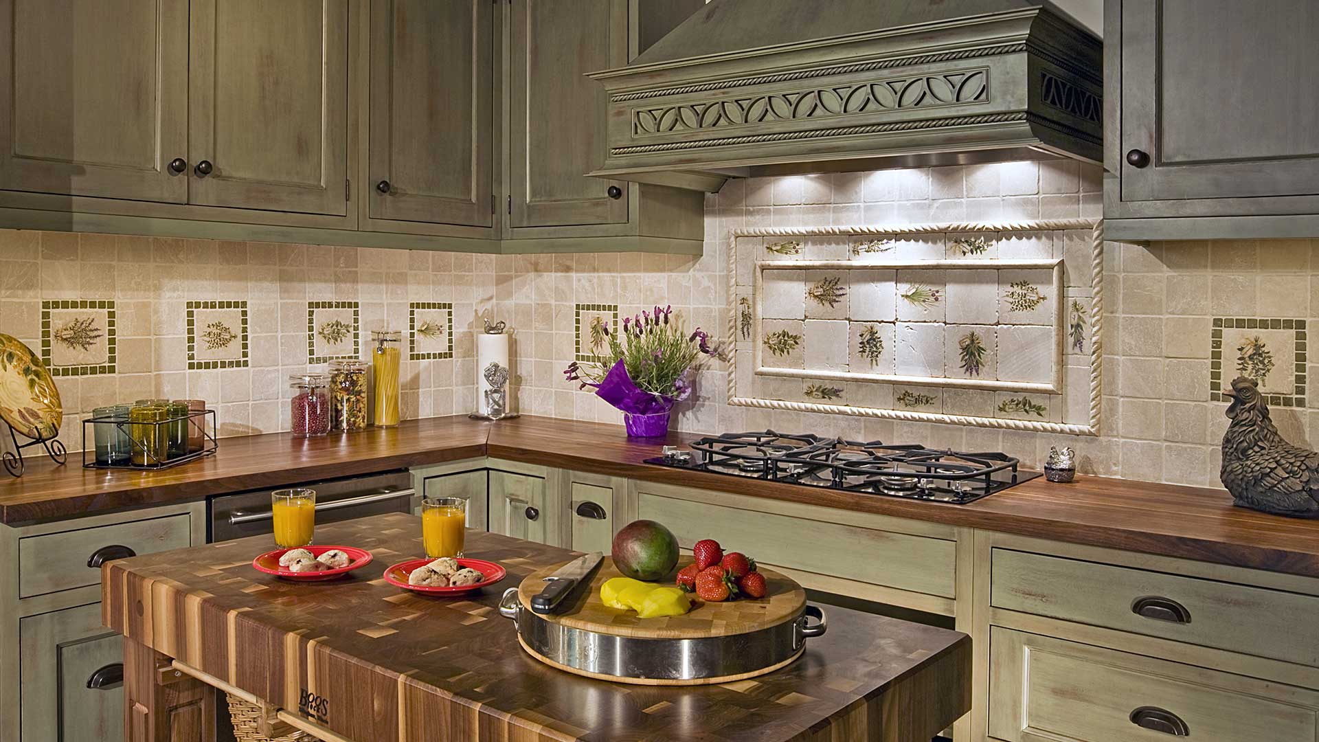 Rustic kitchen with green cabinets and island